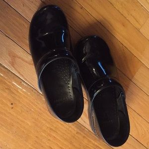 Dansko black patent clogs